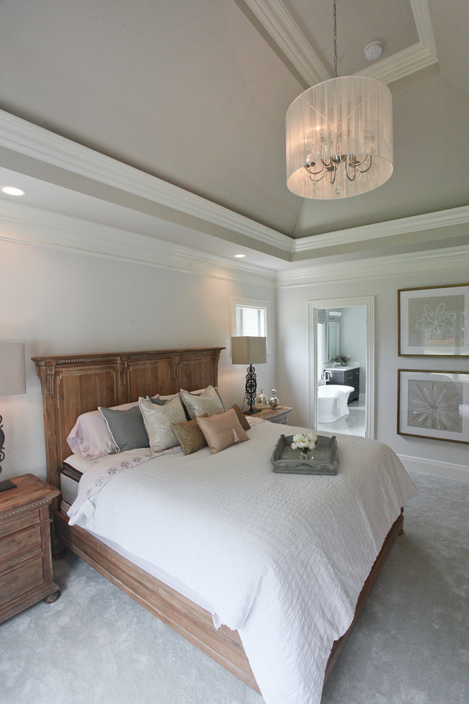 This is an example of a medium sized traditional master bedroom in Louisville.