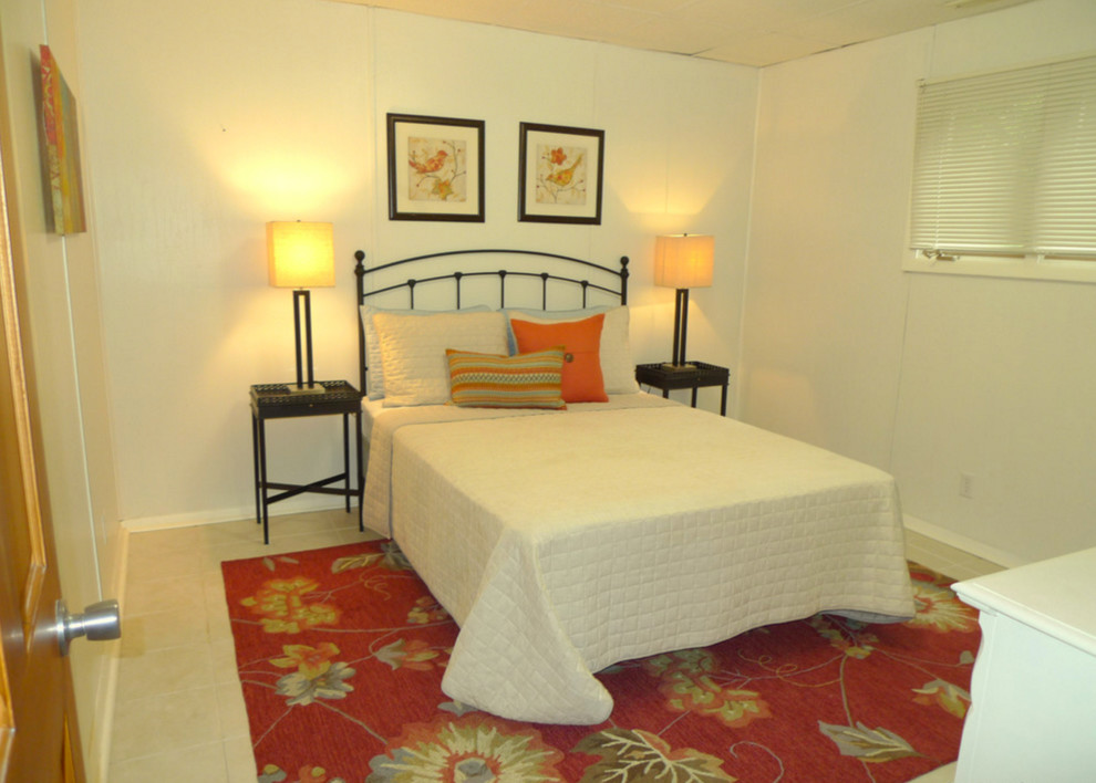 Imagen de habitación de invitados actual con suelo de baldosas de cerámica