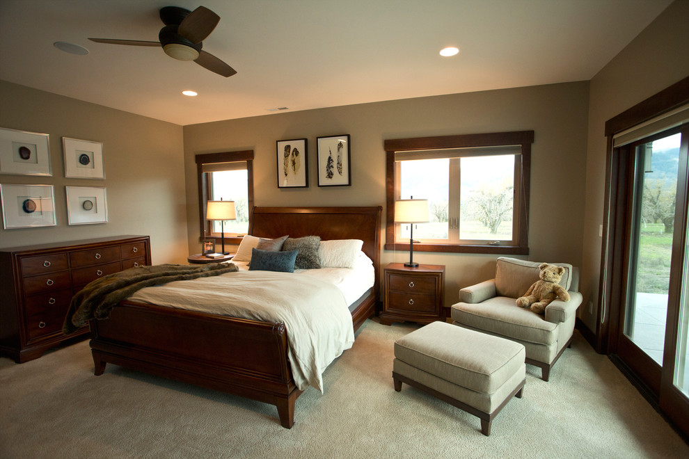Design ideas for a large traditional master bedroom in Portland with beige walls, carpet, a standard fireplace and a tiled fireplace surround.
