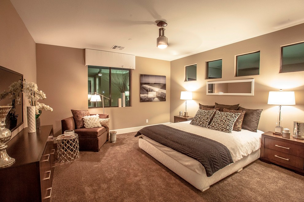 Example of a mid-sized eclectic guest carpeted bedroom design in Las Vegas with beige walls and no fireplace