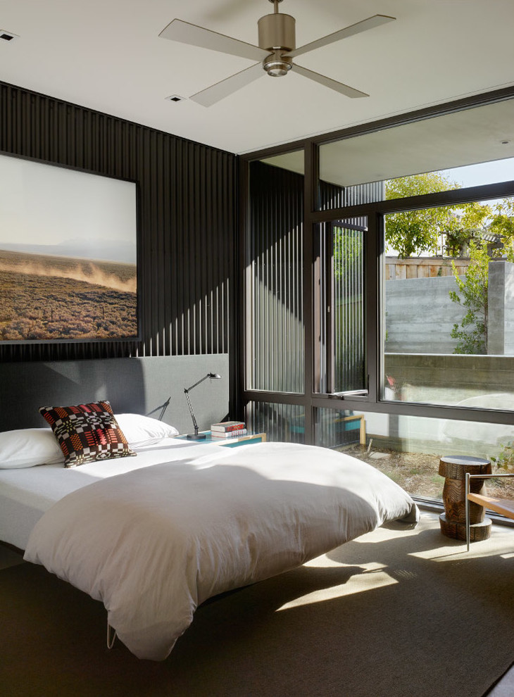 Imagen de dormitorio moderno con moqueta