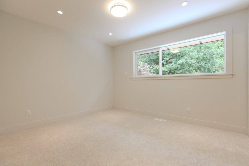 Medium sized contemporary guest bedroom in Vancouver with white walls, carpet and no fireplace.
