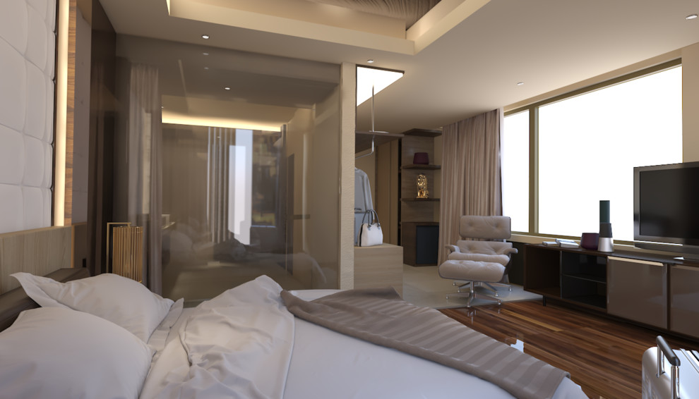 Idée de décoration pour une chambre d'amis minimaliste avec un mur beige, sol en stratifié et un sol marron.