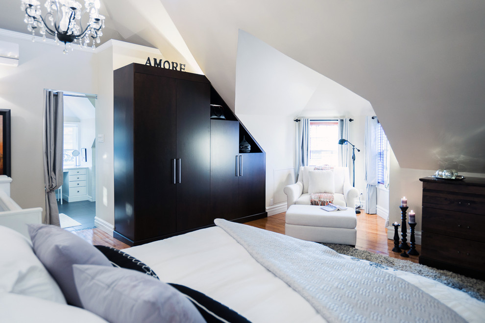 Large trendy master medium tone wood floor and brown floor bedroom photo in Montreal with gray walls