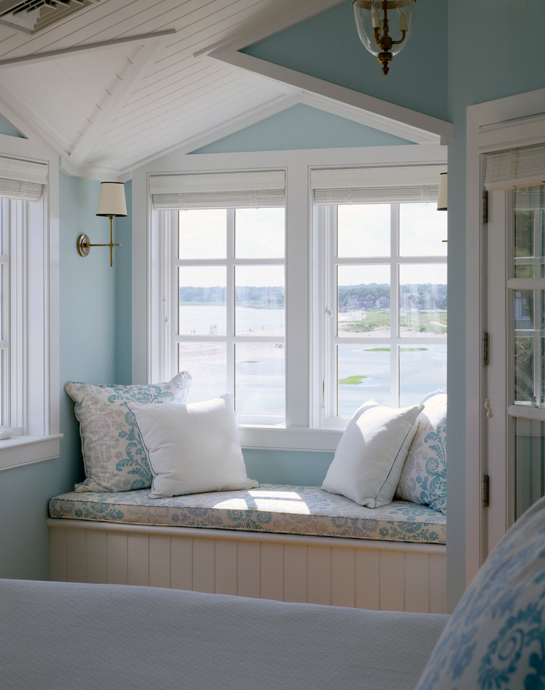 Elegant bedroom photo in Boston with blue walls