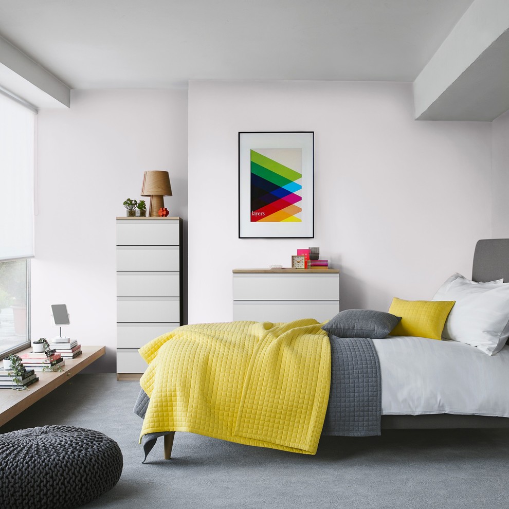 Photo of a contemporary grey and yellow bedroom in London.