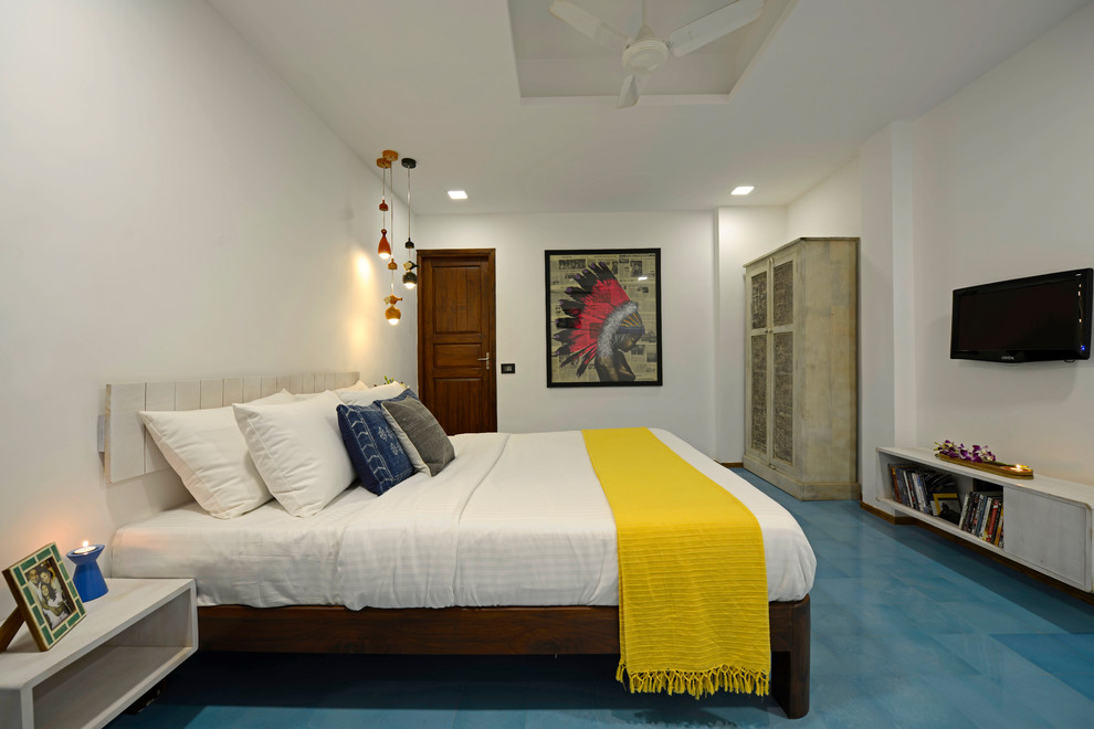 Example of a mid-sized trendy blue floor bedroom design in Other with white walls