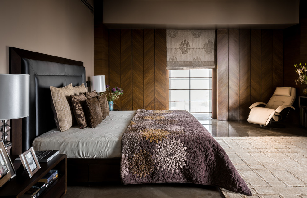Example of a large trendy bedroom design in Mumbai with beige walls