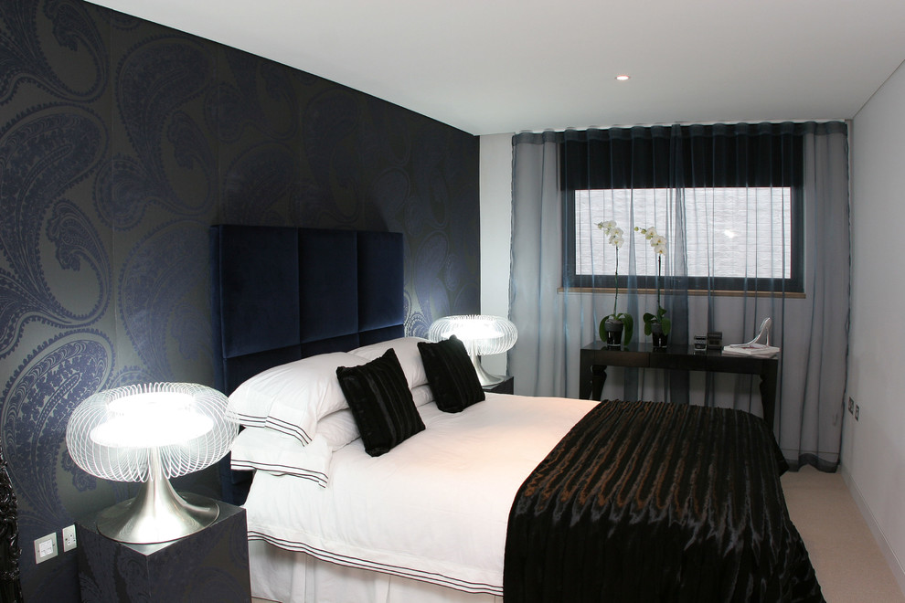 Example of a trendy bedroom design in London with multicolored walls