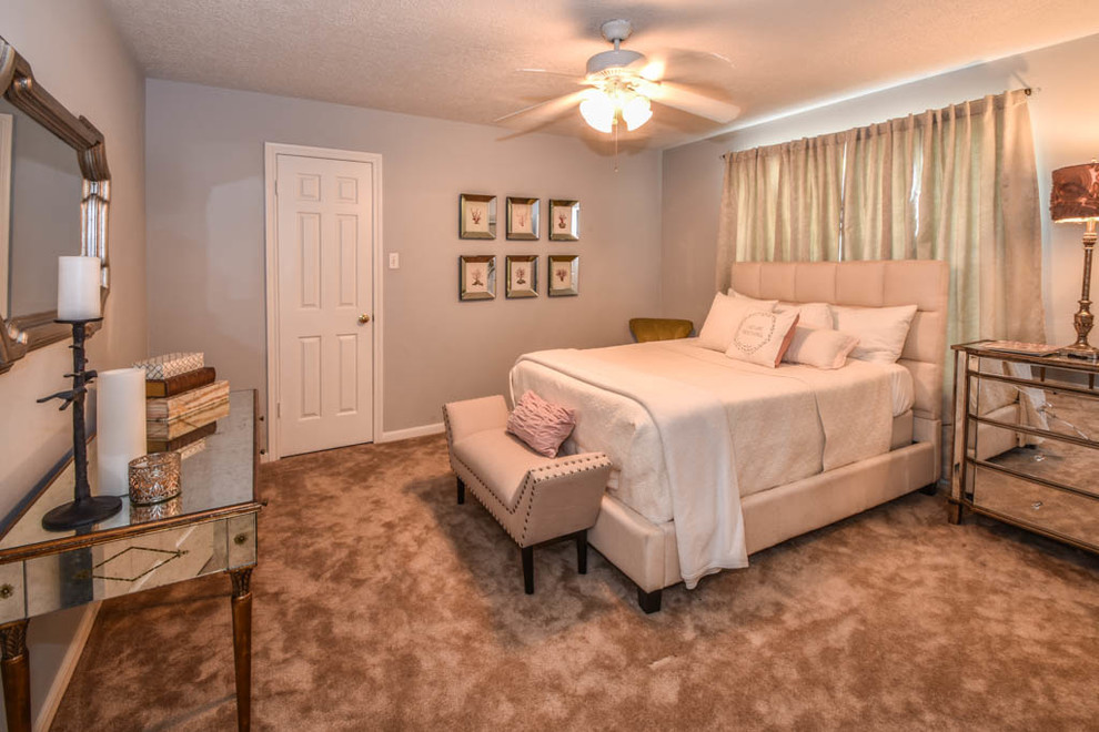 Medium sized contemporary guest bedroom in Houston with grey walls and carpet.