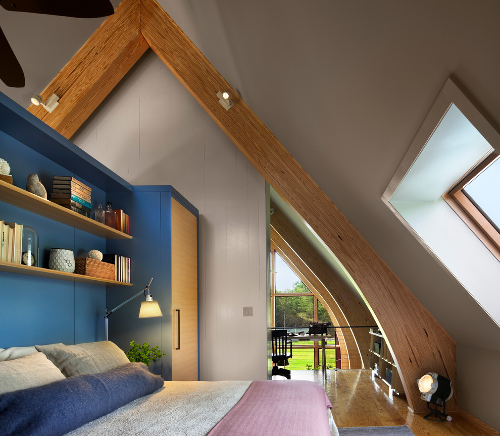 Design ideas for a contemporary loft bedroom in New York with blue walls.