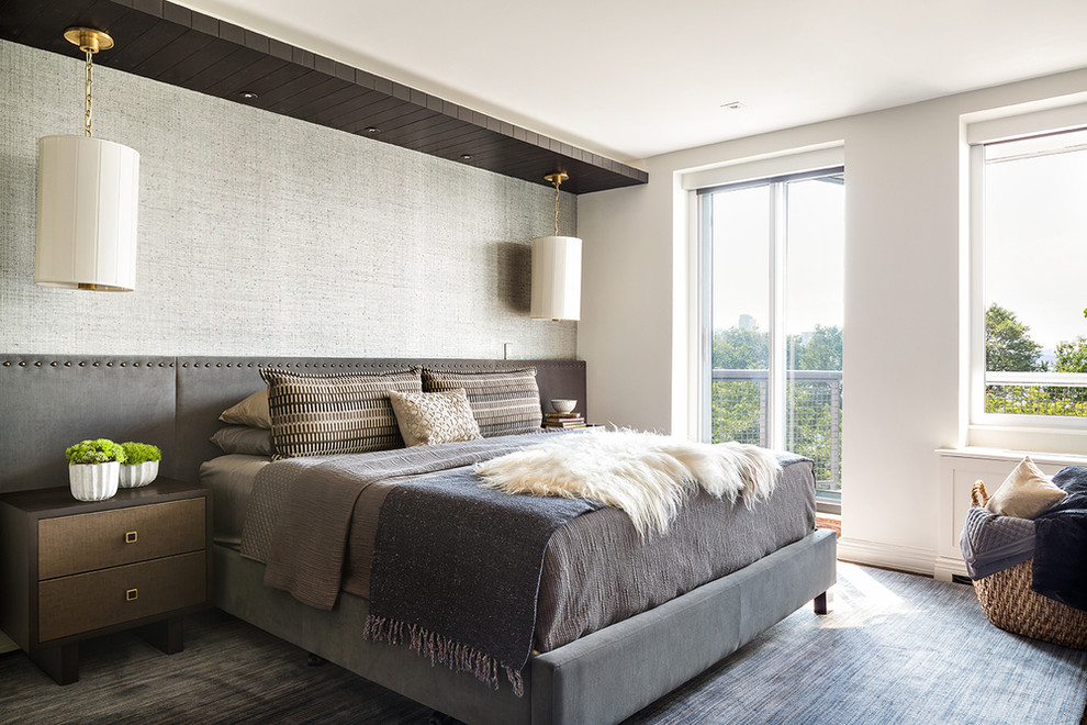 Photo of a contemporary master bedroom in New York with white walls, carpet, grey floors and no fireplace.
