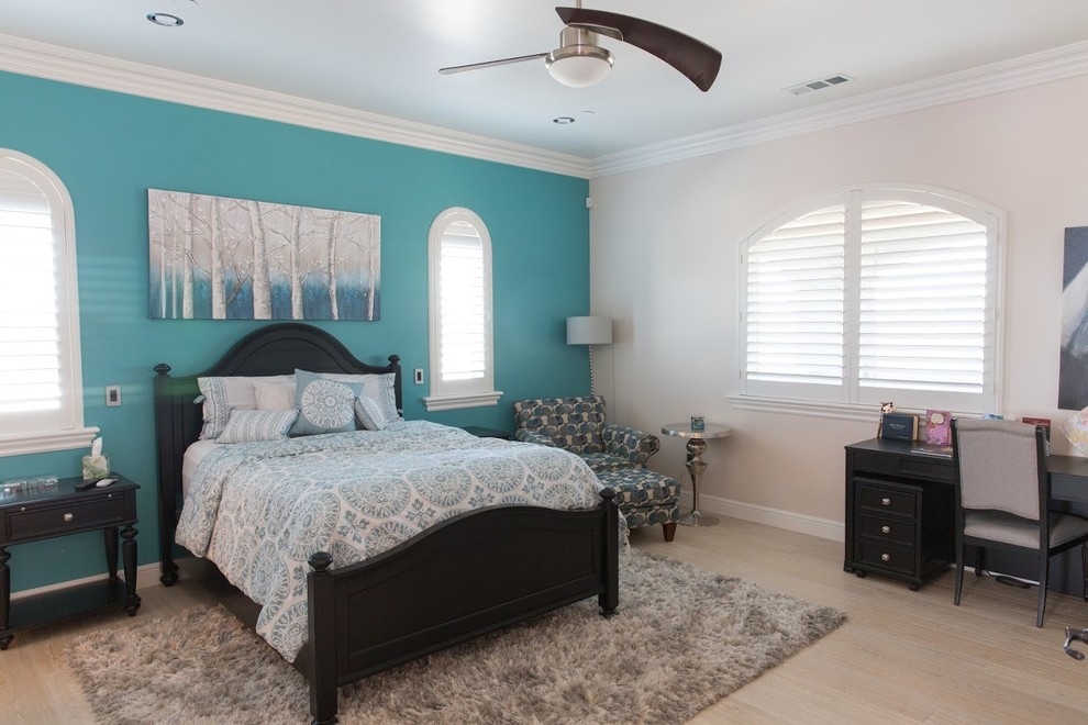 Medium sized classic bedroom in Sacramento with multi-coloured walls, light hardwood flooring and no fireplace.