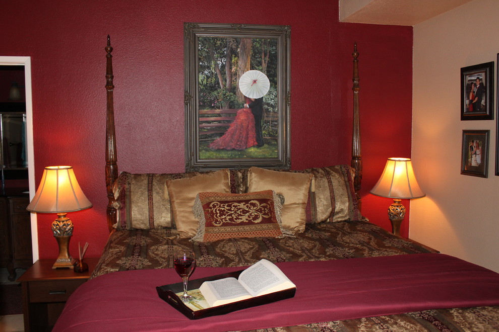 Medium sized traditional master bedroom in Orange County with red walls, carpet and no fireplace.