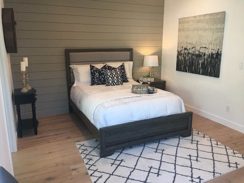 Design ideas for a medium sized country master bedroom in Los Angeles with white walls, light hardwood flooring, no fireplace and brown floors.