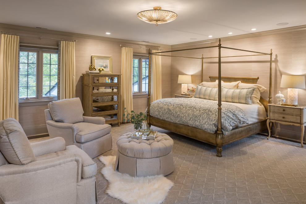 This is an example of a traditional master bedroom in Cincinnati with beige walls, carpet and grey floors.