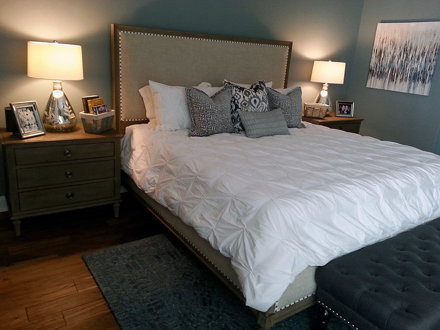 Photo of a large traditional master bedroom in Orlando with blue walls, porcelain flooring and brown floors.
