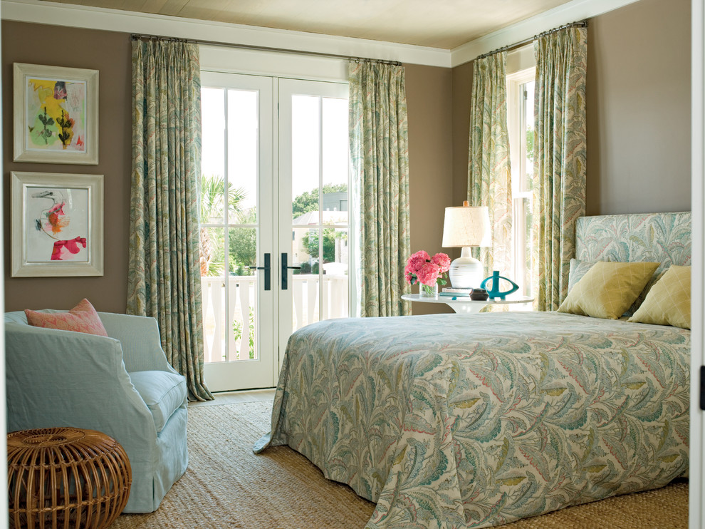 This is an example of a world-inspired bedroom in Charleston with beige walls.