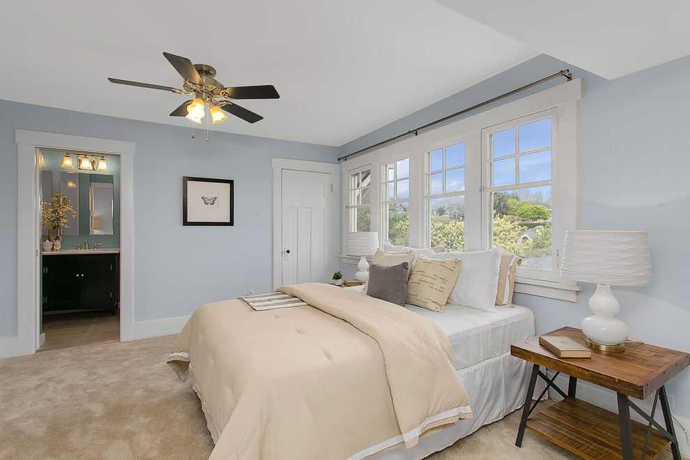Design ideas for a large classic master bedroom in Seattle with blue walls and carpet.