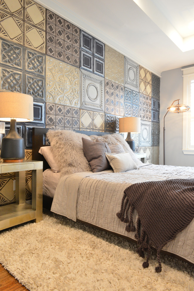 This is an example of a bohemian grey and brown bedroom in Houston with multi-coloured walls and feature lighting.