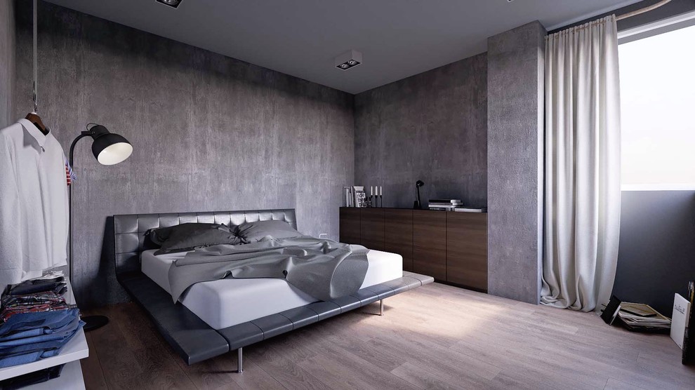 Esempio di una camera da letto moderna di medie dimensioni con pavimento in legno massello medio