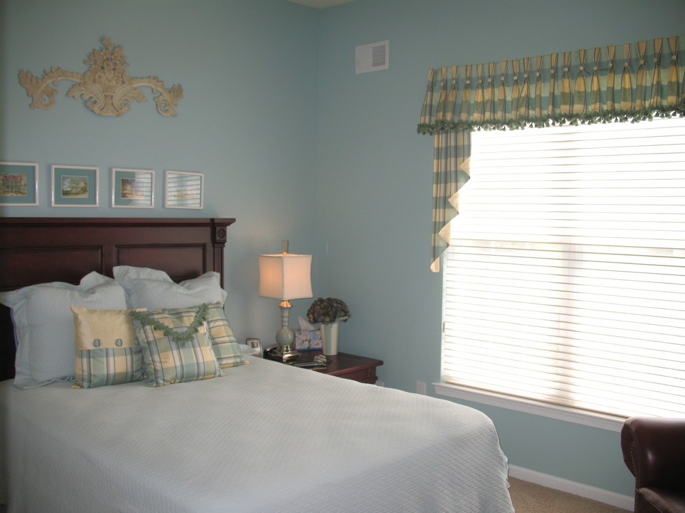 Photo of a small traditional guest bedroom in Newark with blue walls and carpet.