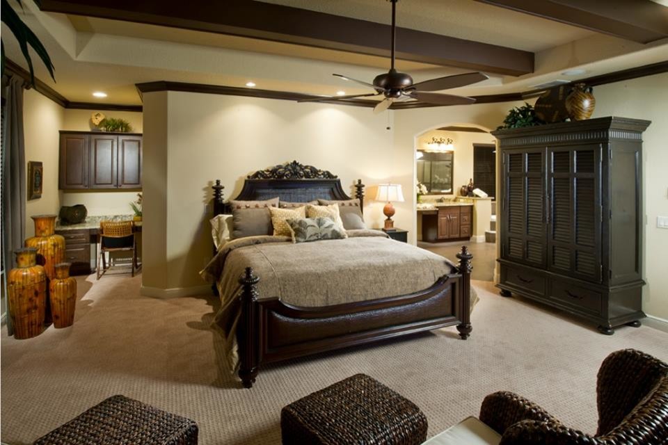 Example of an island style master bedroom design in Orlando