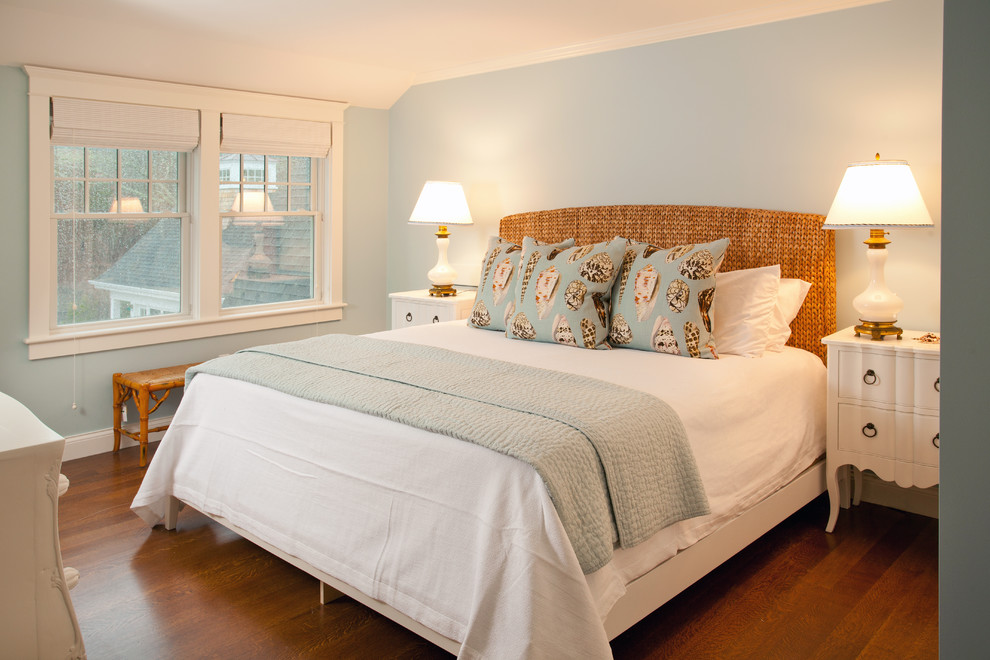 Medium sized beach style guest bedroom in Boston with blue walls and dark hardwood flooring.