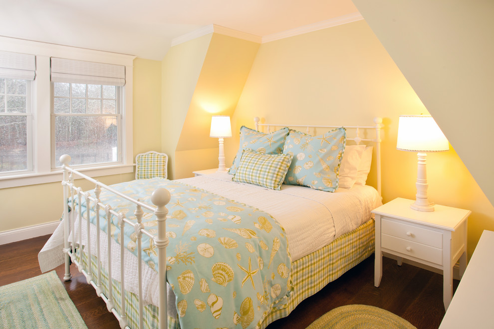 This is an example of a small nautical guest bedroom in Boston with yellow walls, dark hardwood flooring and no fireplace.