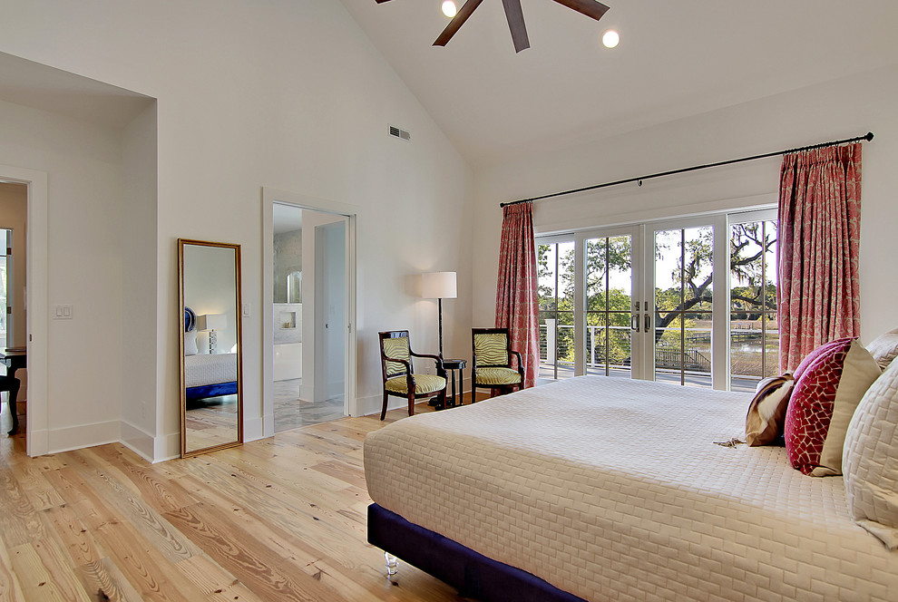 Large transitional master light wood floor bedroom photo in Charleston with white walls and no fireplace