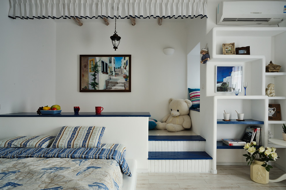 This is an example of a mediterranean bedroom in Hong Kong with white walls.