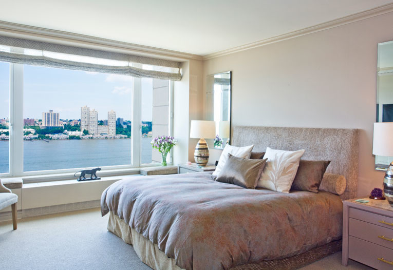 Inspiration for a timeless master carpeted bedroom remodel in New York with beige walls
