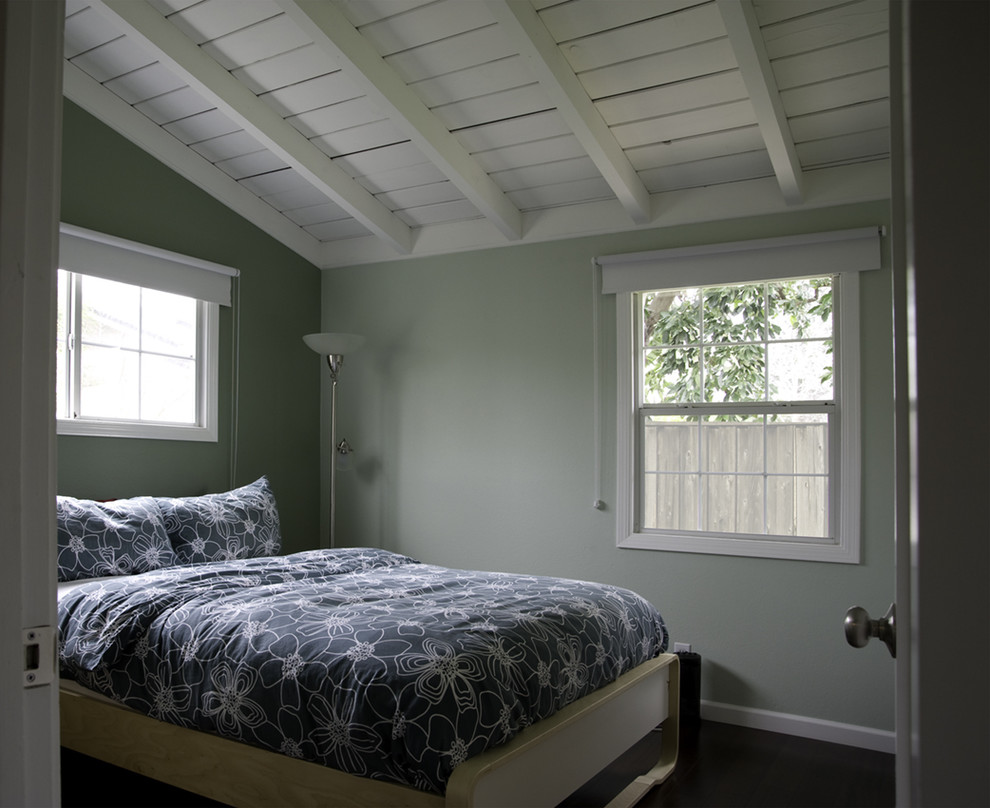 Example of a mid-sized minimalist dark wood floor bedroom design in San Francisco