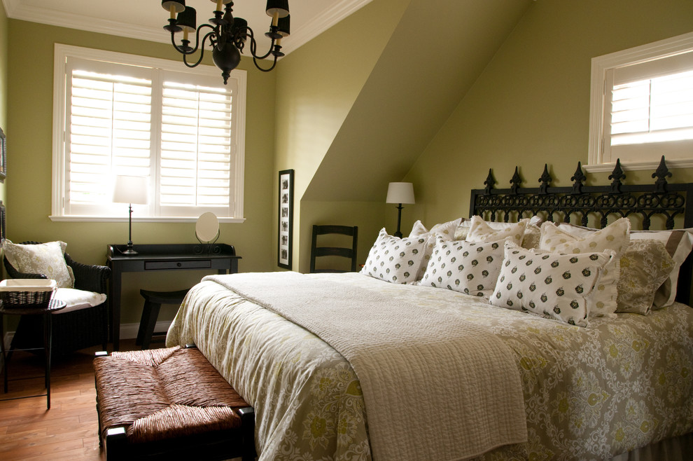 Inspiration for a mid-sized contemporary guest medium tone wood floor and brown floor bedroom remodel in Vancouver with green walls and no fireplace