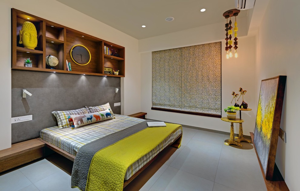 Idee per una camera da letto design di medie dimensioni con pareti bianche, pavimento in cemento e pavimento grigio