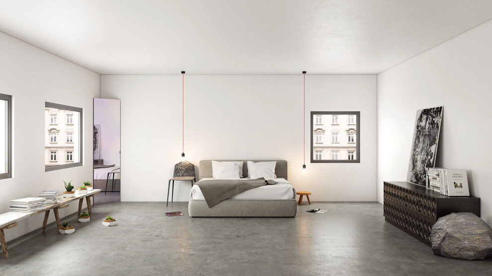 Immagine di una camera da letto contemporanea con pavimento in cemento e pavimento grigio