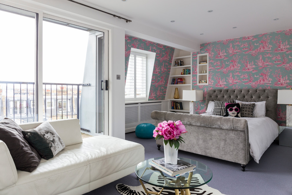 Photo of a bohemian grey and pink bedroom in London with multi-coloured walls and carpet.