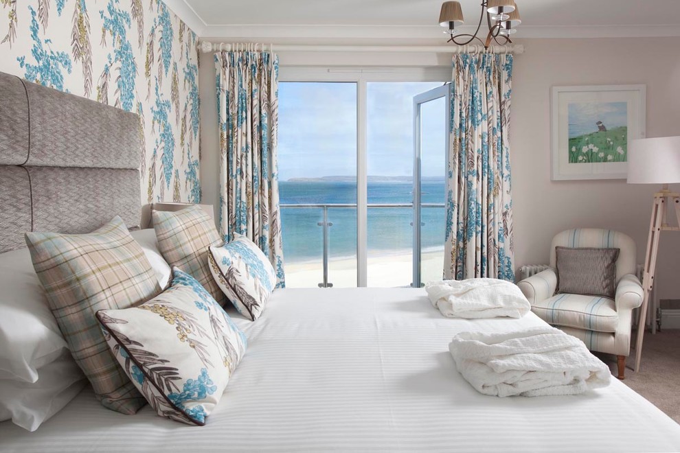 Medium sized nautical master bedroom in Cornwall with beige walls, carpet and no fireplace.