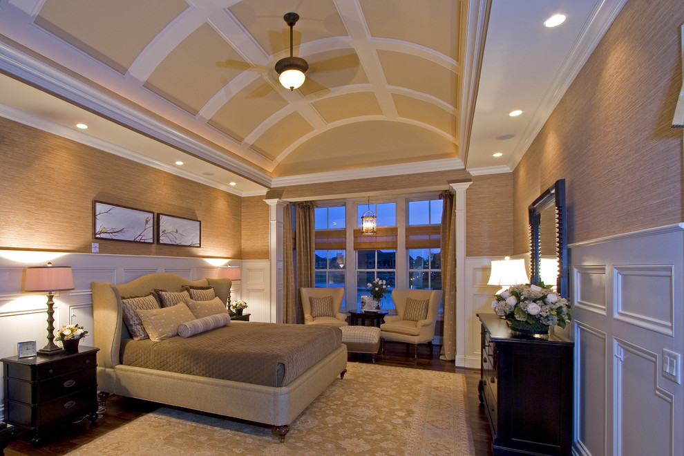 Traditional bedroom in Cincinnati with beige walls and dark hardwood flooring.