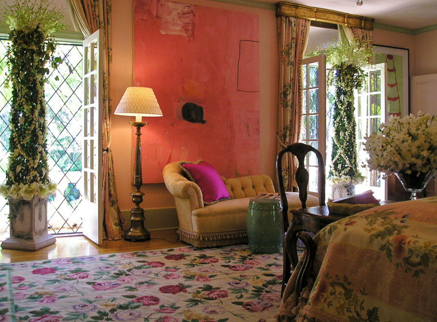Example of a large ornate master medium tone wood floor and brown floor bedroom design in Los Angeles with pink walls and no fireplace