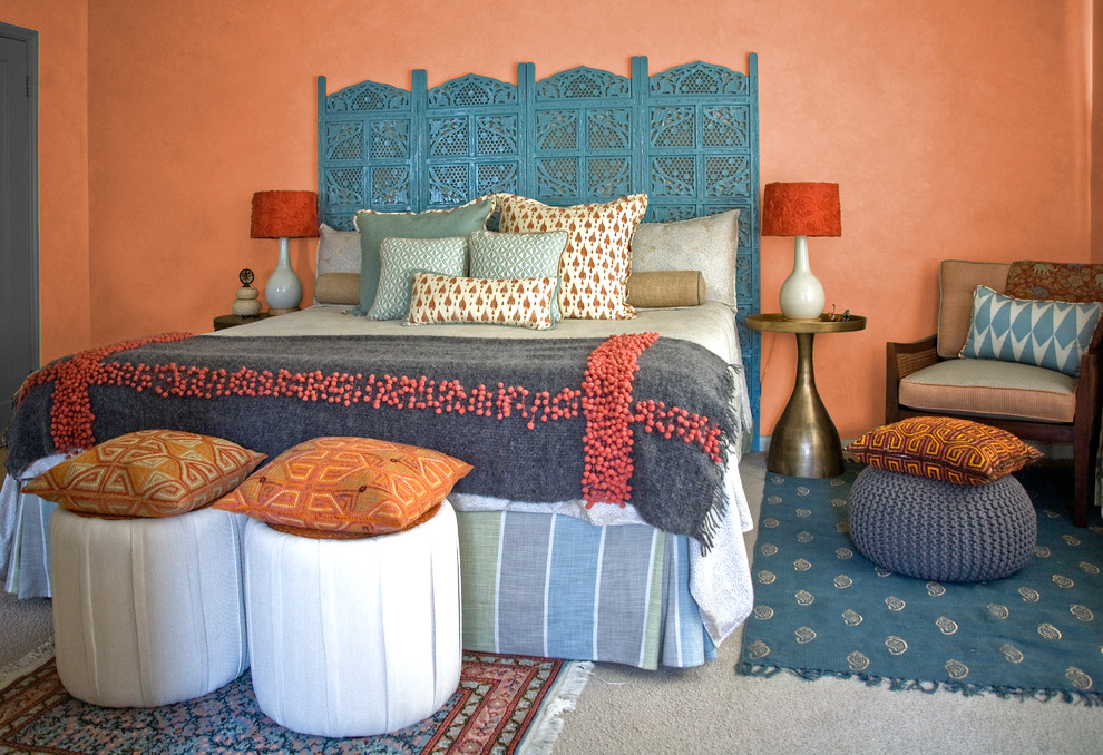 Design ideas for a world-inspired bedroom in San Francisco with orange walls, carpet and no fireplace.