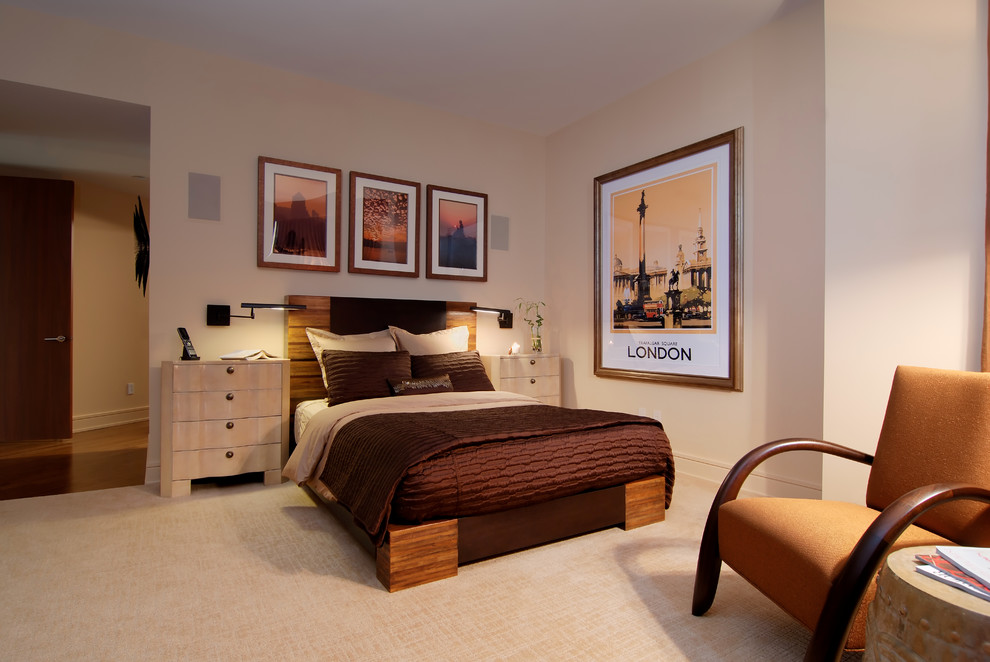 Medium sized contemporary master bedroom in Chicago with beige walls and carpet.