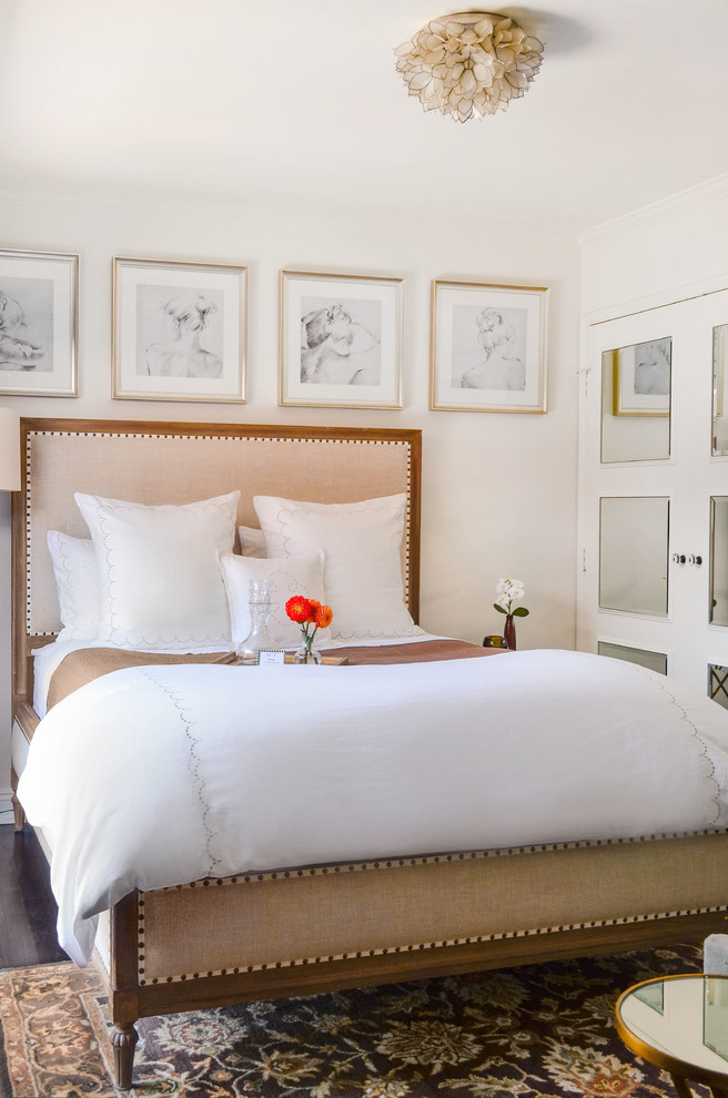 Mid-sized transitional guest dark wood floor and brown floor bedroom photo in Los Angeles with white walls and no fireplace
