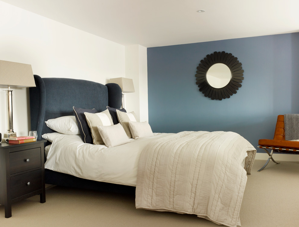 Small transitional master carpeted bedroom photo in London with blue walls