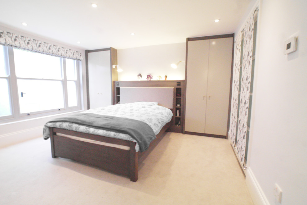 Design ideas for a medium sized contemporary master bedroom in London with grey walls, carpet and no fireplace.
