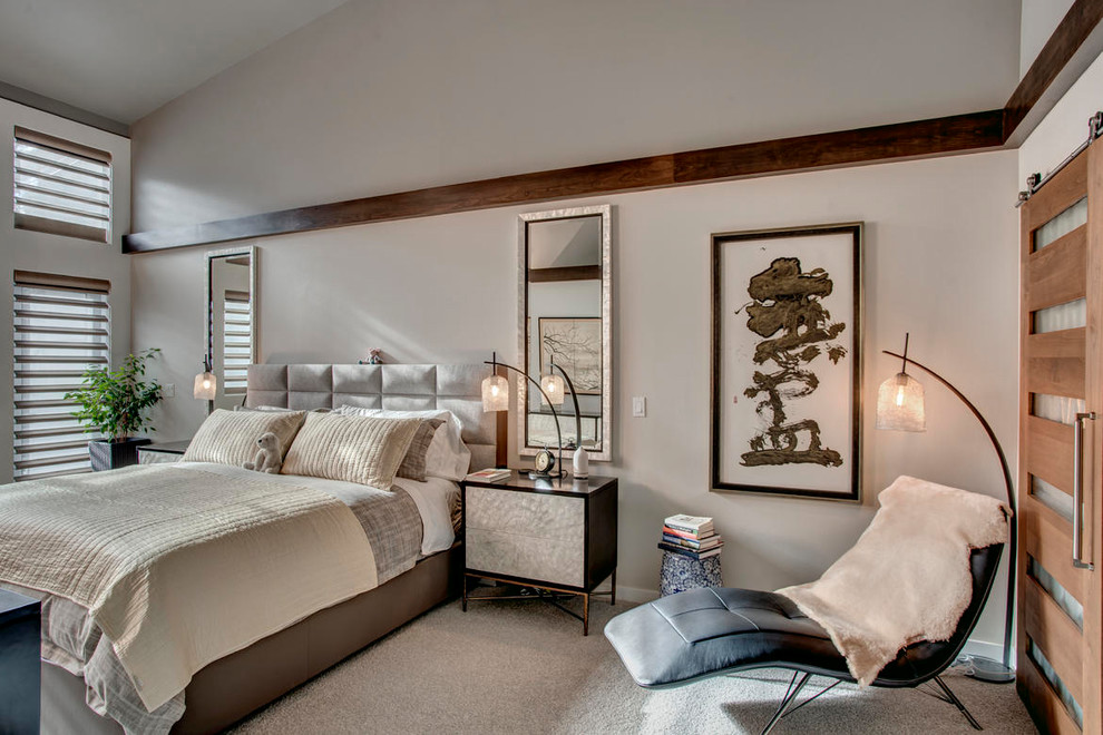 Photo of a medium sized modern master bedroom in Seattle with beige walls, carpet and grey floors.