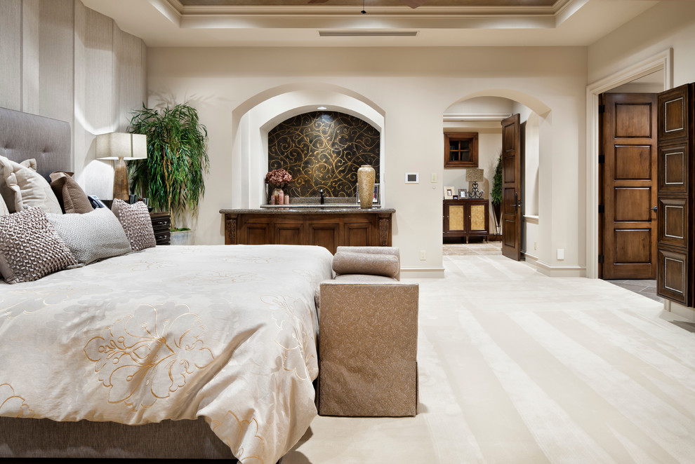 Inspiration for a mid-sized mediterranean master bedroom remodel in Houston