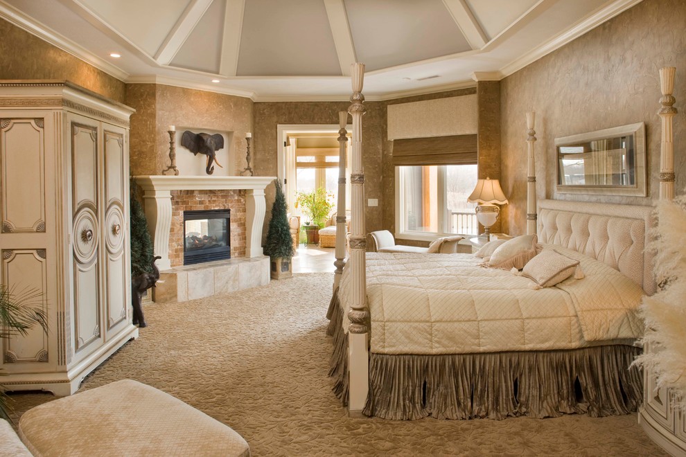 Bedroom - large mediterranean master carpeted bedroom idea in Indianapolis with multicolored walls, a two-sided fireplace and a stone fireplace