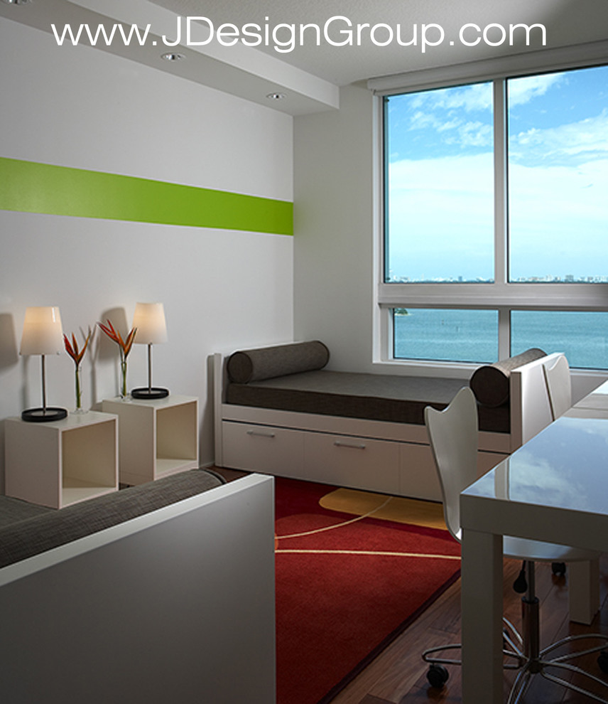 Medium sized contemporary mezzanine bedroom in Miami with multi-coloured walls, dark hardwood flooring and brown floors.
