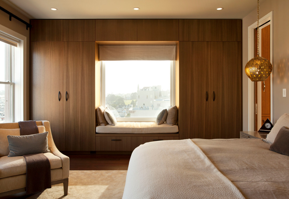 Bedroom - large contemporary master dark wood floor bedroom idea in San Francisco with beige walls